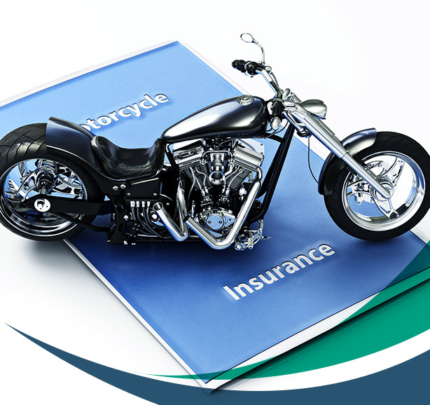 motorcycle toy on top of a motorcycle insurance policy document dartmouth ma